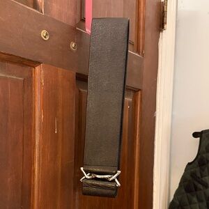 Black Elastic Belt with Silver Buckle, Looks Like Leather.